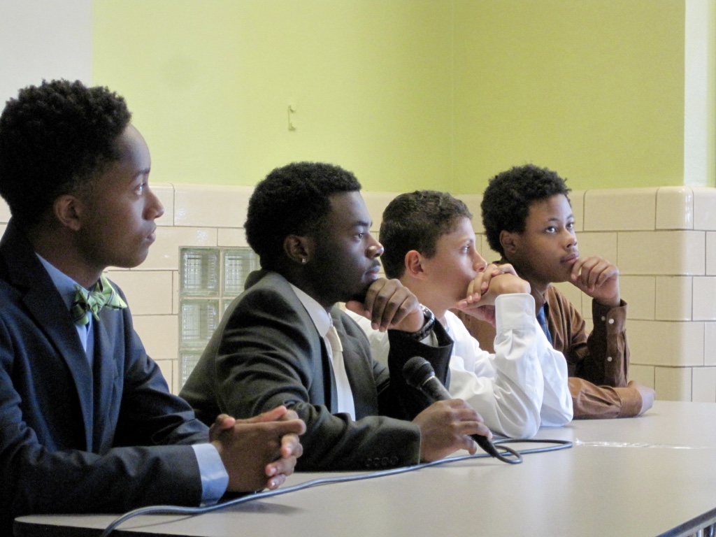 A young man speaking in a leadership workshop